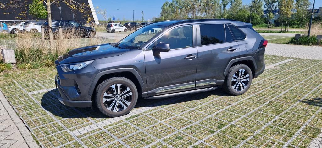 Toyota Rav4 2.5 Hybrid 218pk CVT 2019 Grijs, Auto's, Toyota, 4 cilinders, 2487 cc, 1565 kg, Rav4
