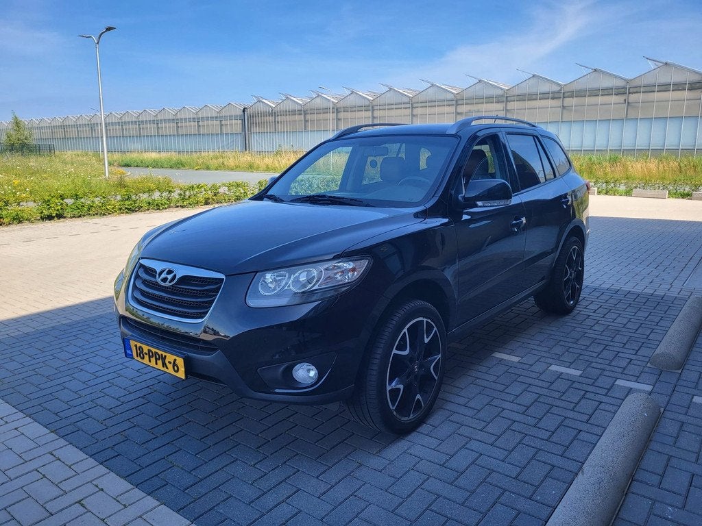 Hyundai Santa Fe 2.4i CVVT 4WD Dynamic AUTOMAAT LEER CLIMA Z, Auto's, Hyundai, Automaat, Euro 5, Gebruikt, 4 cilinders