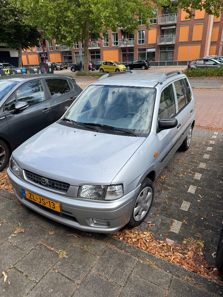 Mazda Demio 1.3 glx 1999 Grijs, Auto's, Mazda, Particulier, Demio, Dakrails, Elektrische buitenspiegels, Elektrische ramen, Metallic lak