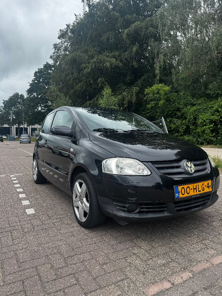 Volkswagen Fox 2009 te koop, Auto's, Overige merken, Stof, Elektrische ramen, Zwart