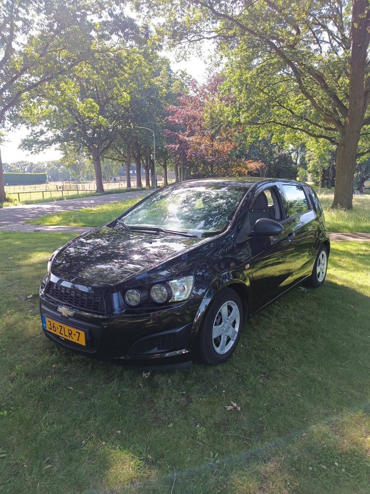 Zeer nette Chevrolet Aveo 1.2 5-DEURS 2013 Zwart 149.303km, 40 €/maand, Aveo, 4 cilinders, 1039 kg
