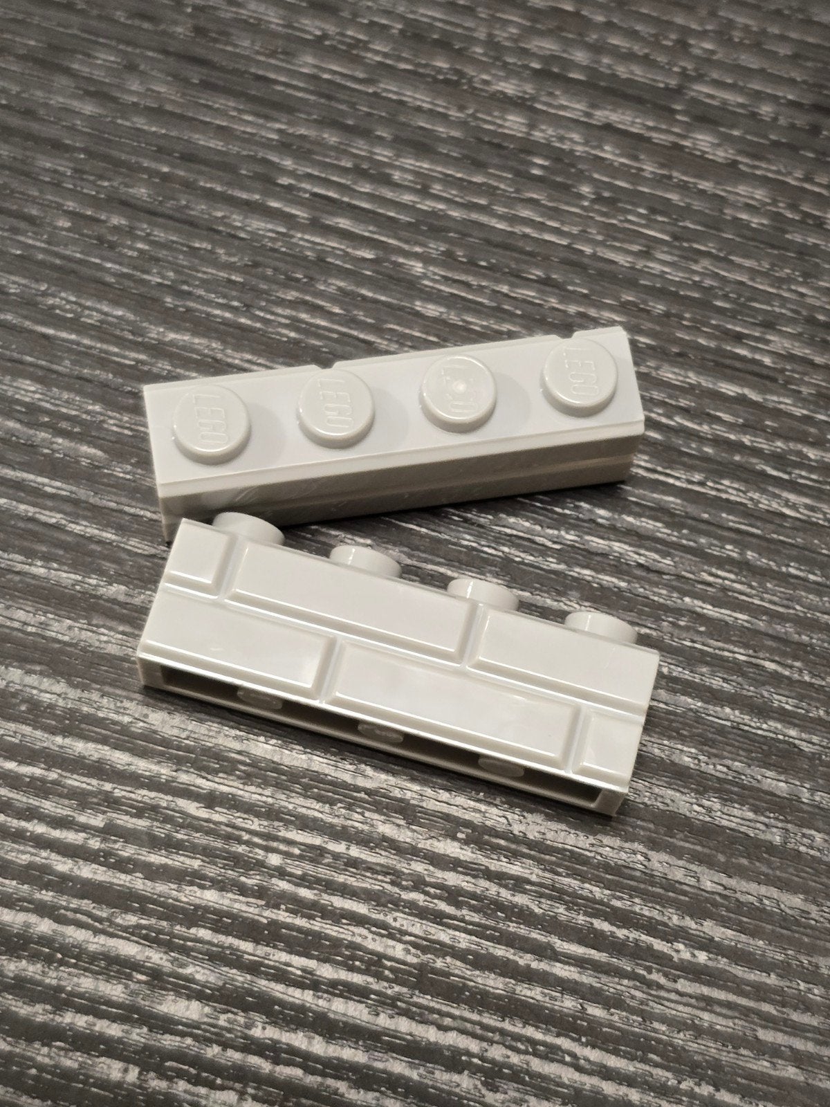 500 stuks lichtgrijs lbg nieuw Lego steenmotief 1x4, Ophalen of Verzenden, Nieuw