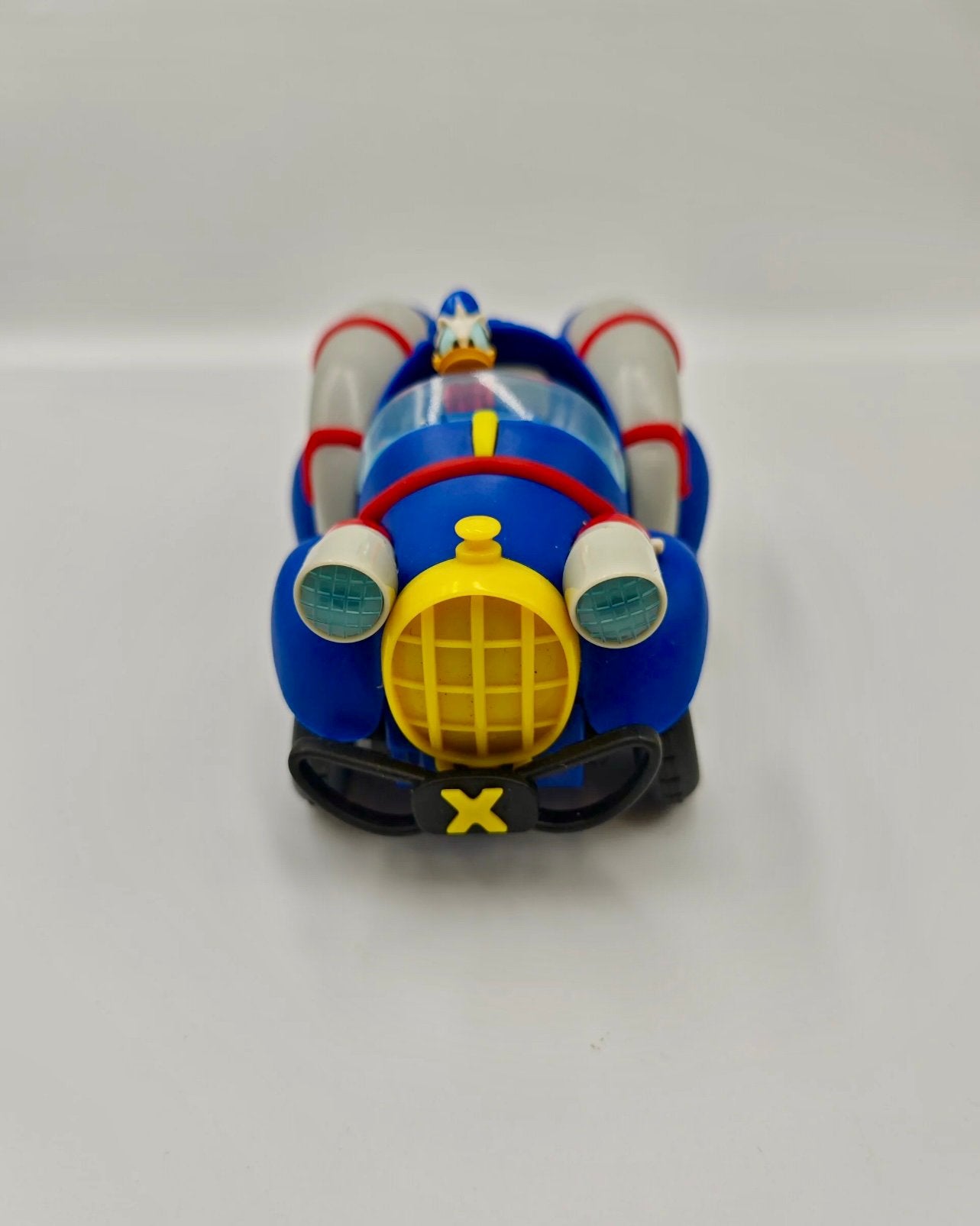 Donald Duck Speelgoed Auto met Raketten en Uitklapwielen, Ophalen, Donald Duck, Zo goed als nieuw, Beeldje of Figuurtje