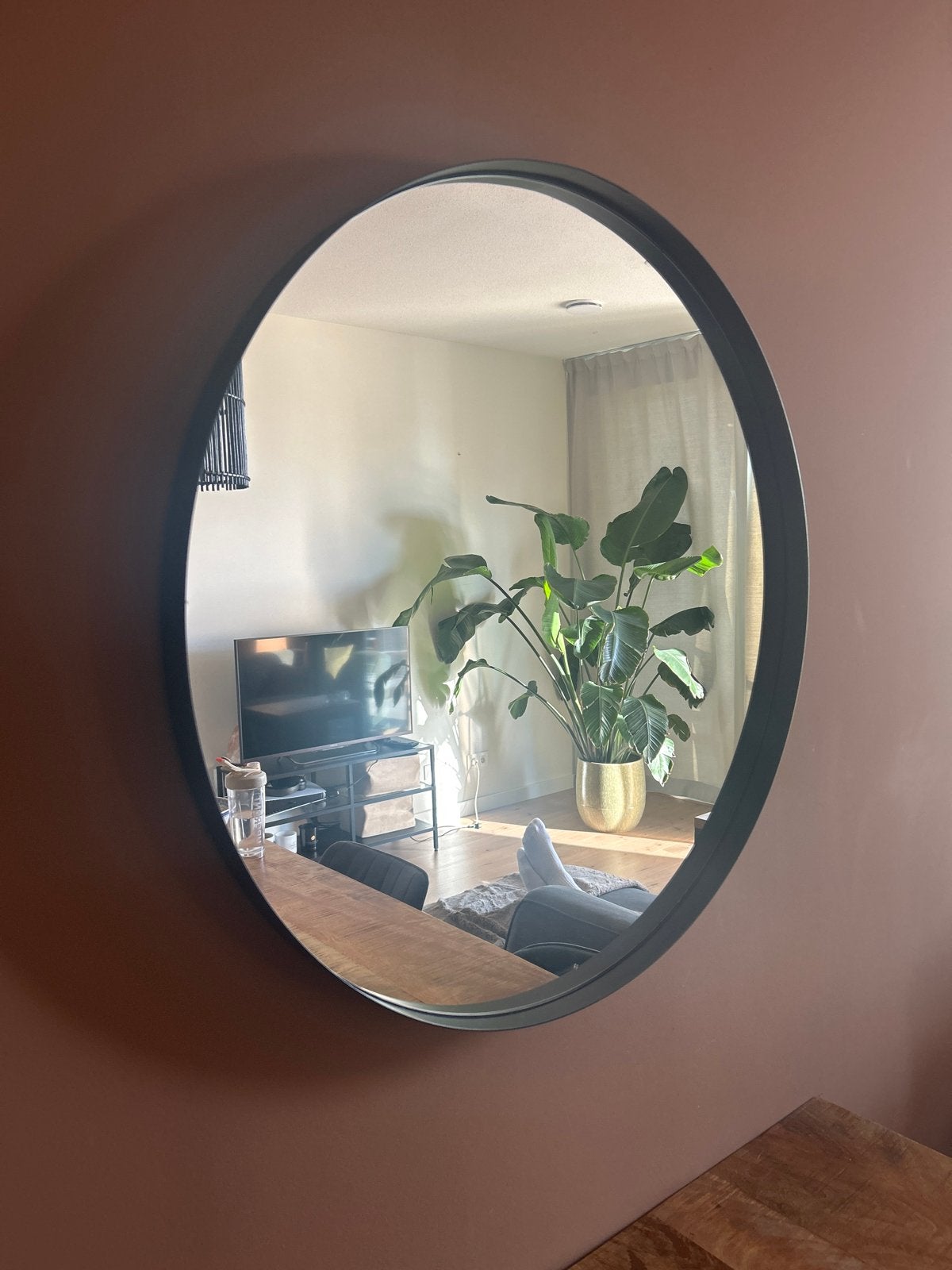 Ronde zwarte spiegel van staal, Huis en Inrichting, Woonaccessoires | Spiegels, Ophalen, 100 tot 150 cm, Zo goed als nieuw, Ovaal