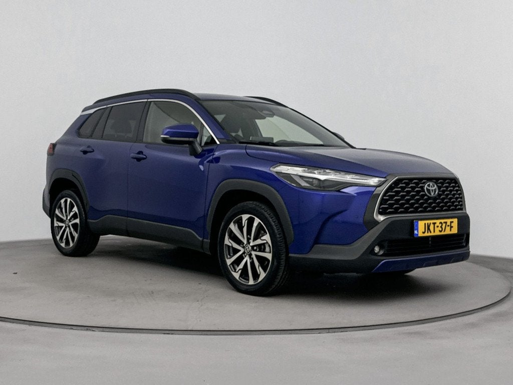 Toyota Corolla Cross Hybrid 140 Style Luxury | Stuur-/stoelv, Auto's, Toyota, Gebruikt, 4 cilinders, Blauw, Leder en Stof