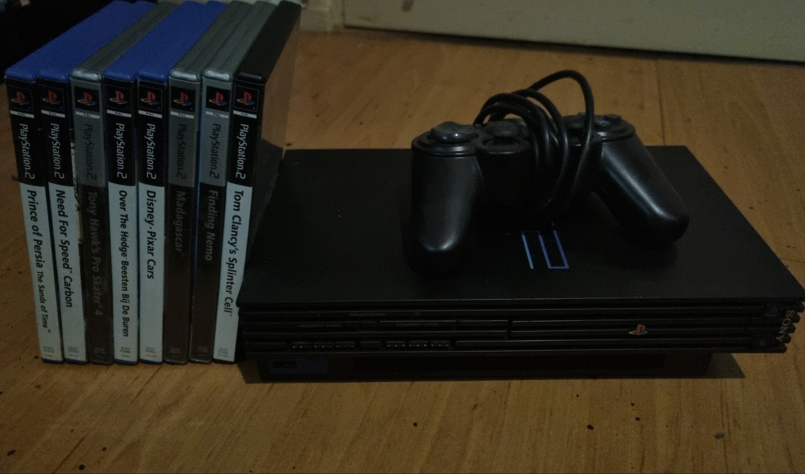 Complete PS2 met 2 controllers & 8 games (m2456028476) — Spelcomputers ...