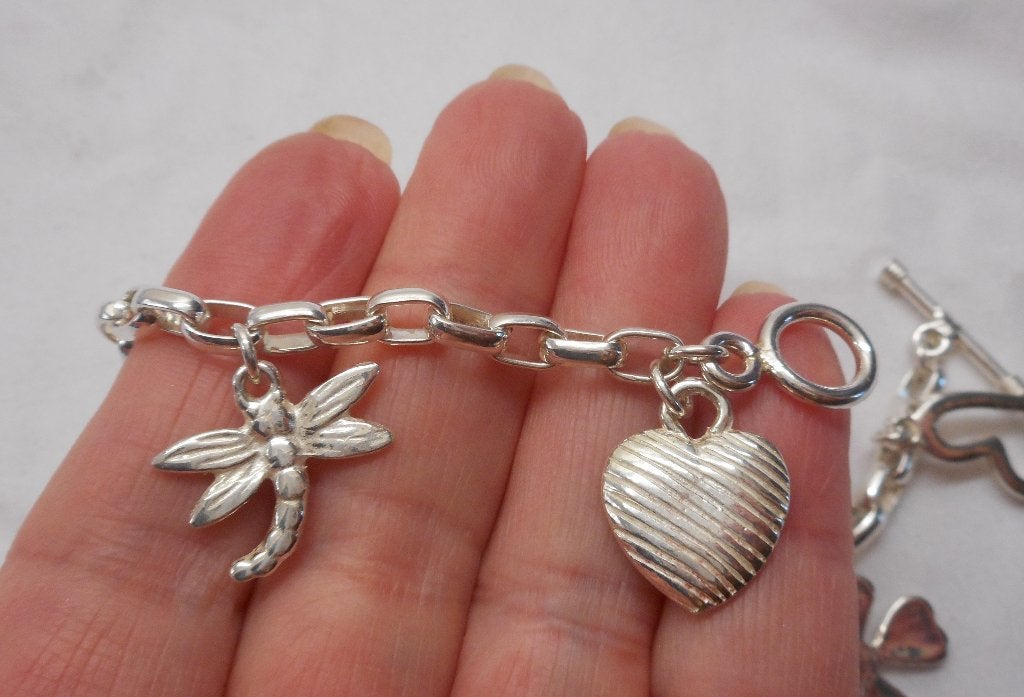 Zilveren bedel armband met 7 mooie bedels nr.114, Verzenden, Zo goed als nieuw, Met bedels of kralen, Zilver
