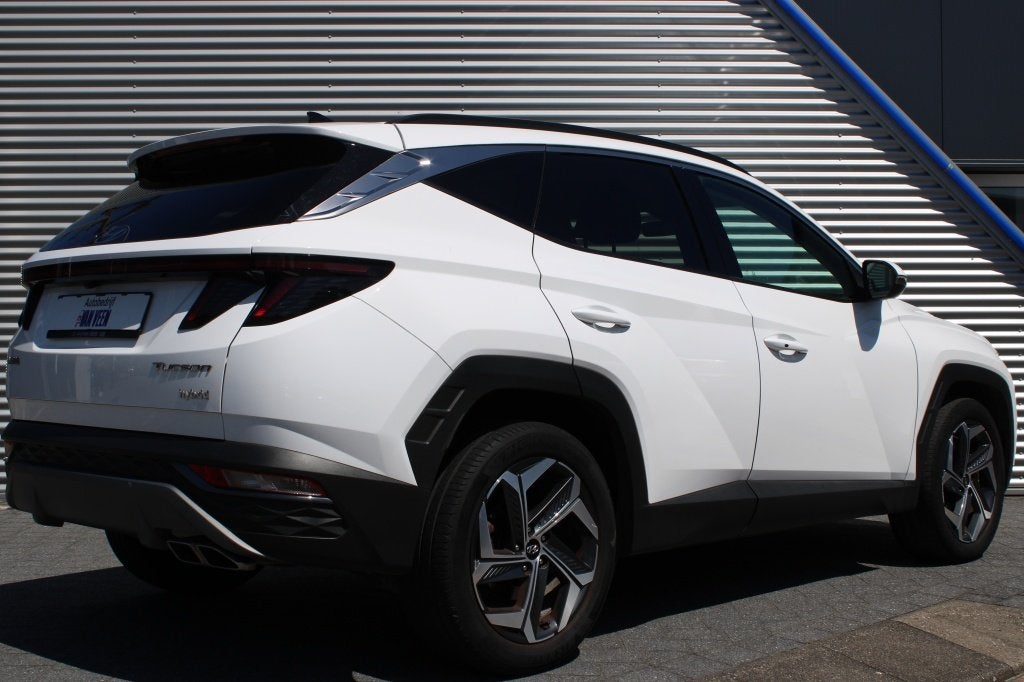 Hyundai Tucson 1.6 T-GDI HEV Comfort Smart | 19 inch | Camer, Auto's, Gebruikt, Zwart, 4 cilinders, 1650 kg