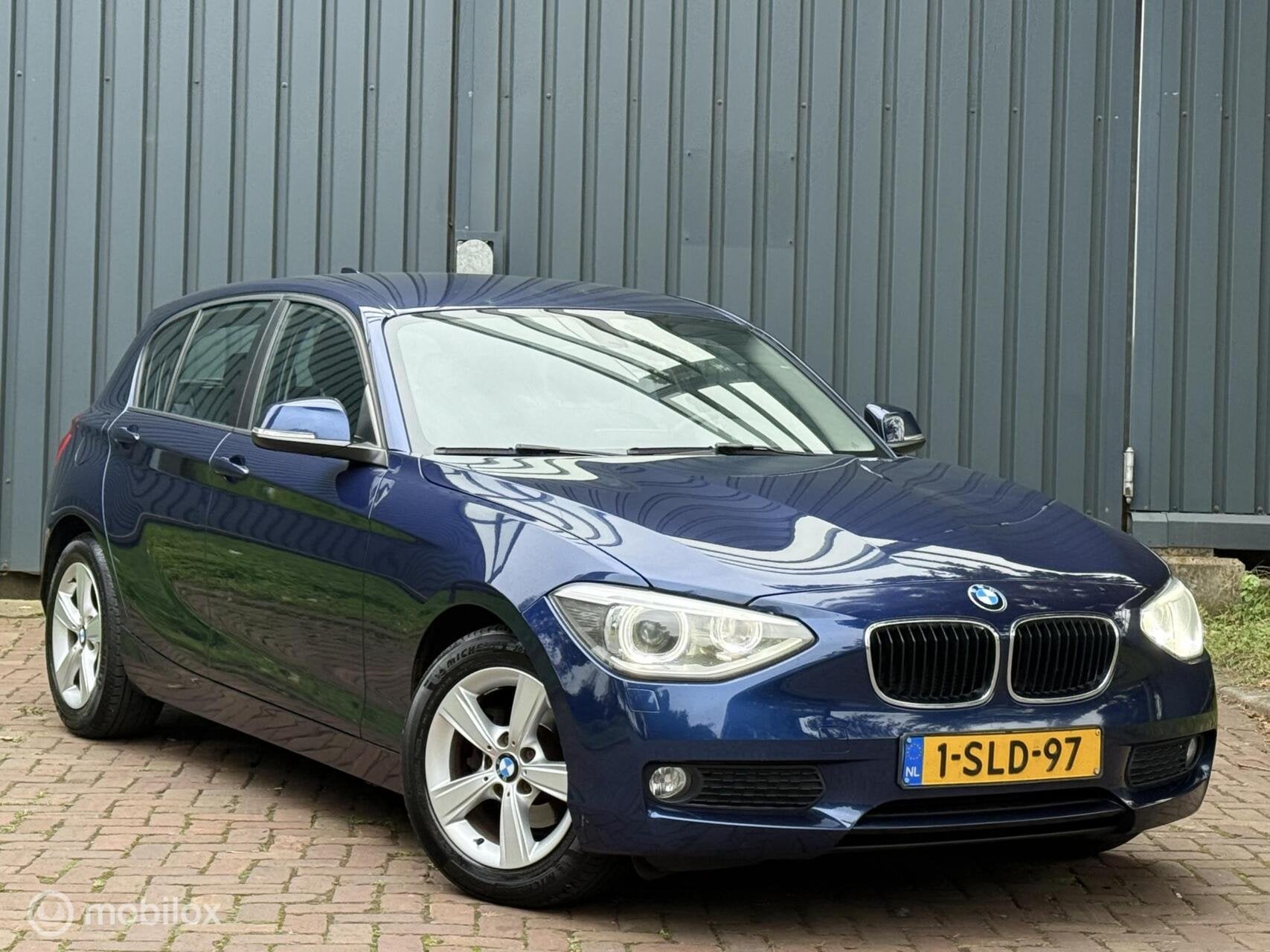 BMW 1-serie 116i EDE Executive |Navi|Clima|Cruise|Xenon|Led, Auto's, Gebruikt, Euro 6, 4 cilinders, Blauw
