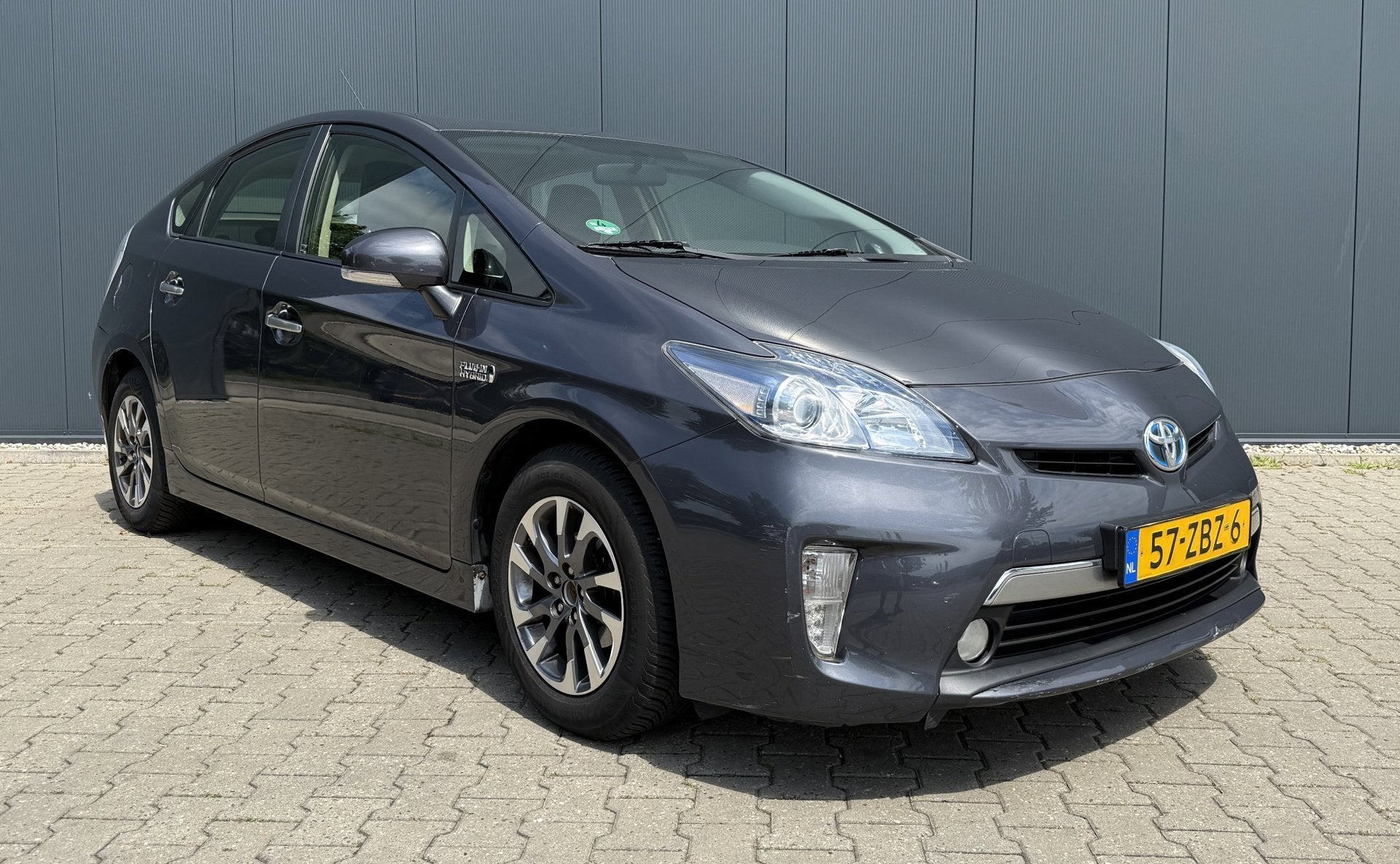 Toyota Prius 1.8 Plug-in Aspiration Airco Cruise Automaat AP, Auto's, Euro 5, Stof, Gebruikt, Zwart