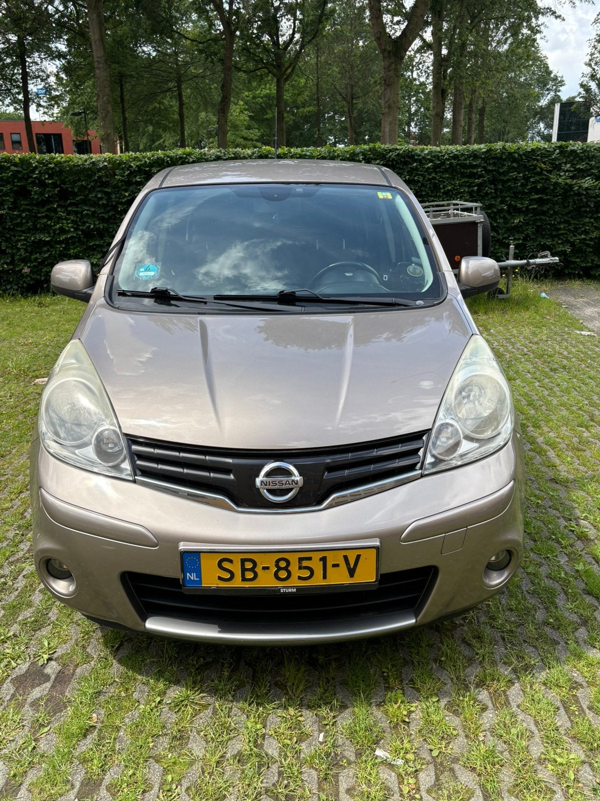 Nissan Note 1.4 16V Luxury 2010 Bruin, Auto's, Nissan, Voorwielaandrijving, Stof, Beige, 4 cilinders