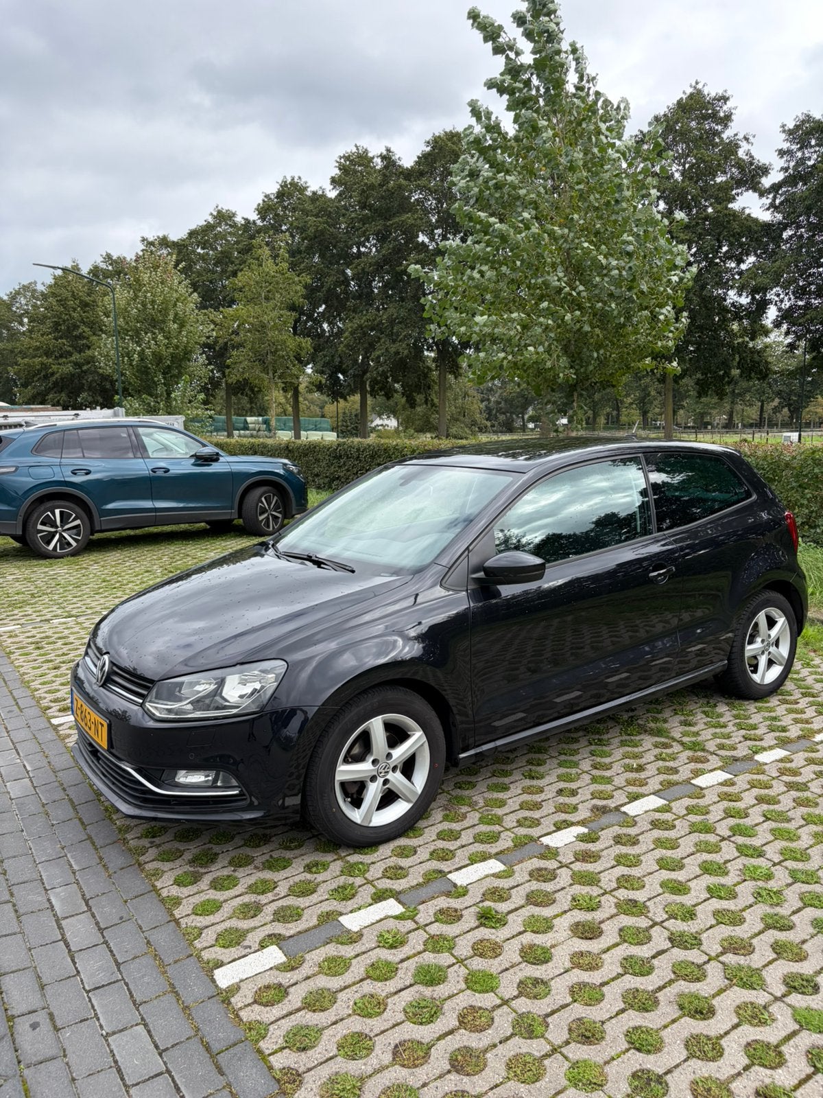 Volkswagen Polo 1.2 TSI 66KW 5D BMT 2014 Zwart, Auto's, Stof, 40 €/maand, Zwart, 4 cilinders