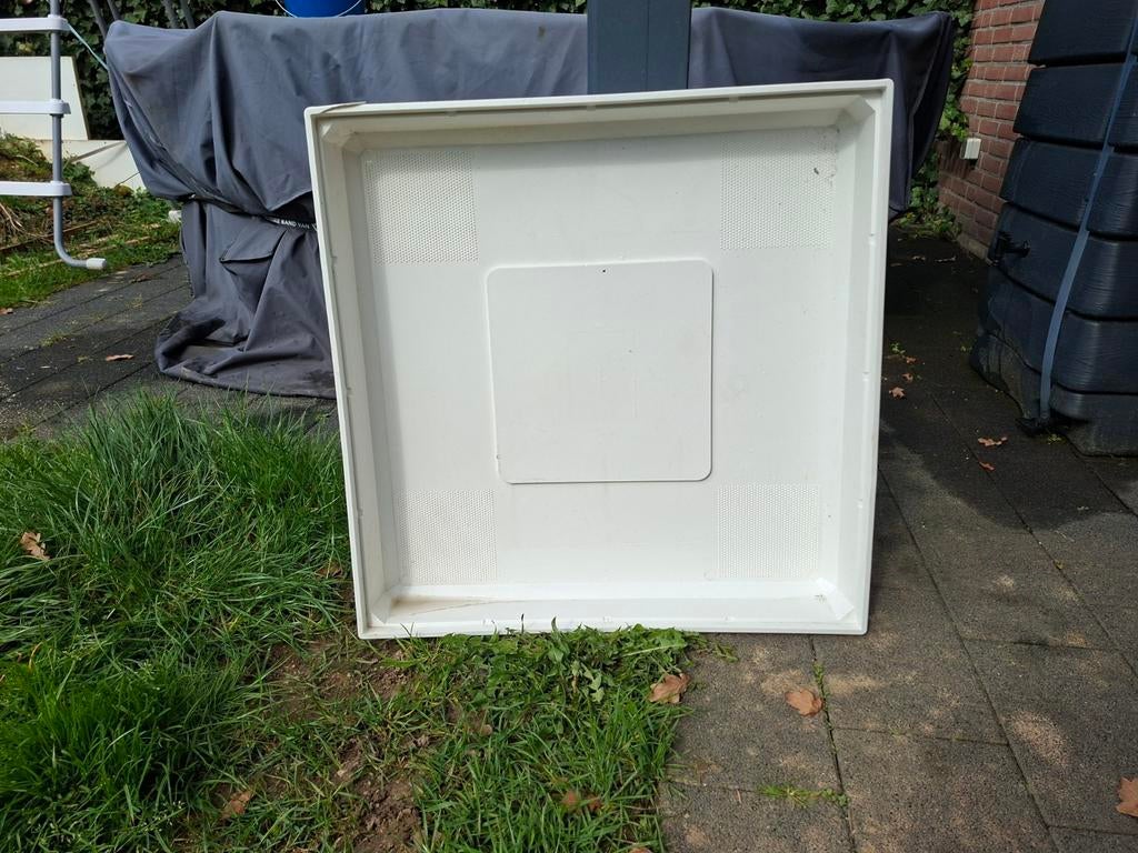 Opvang bak wasmachine., Ophalen