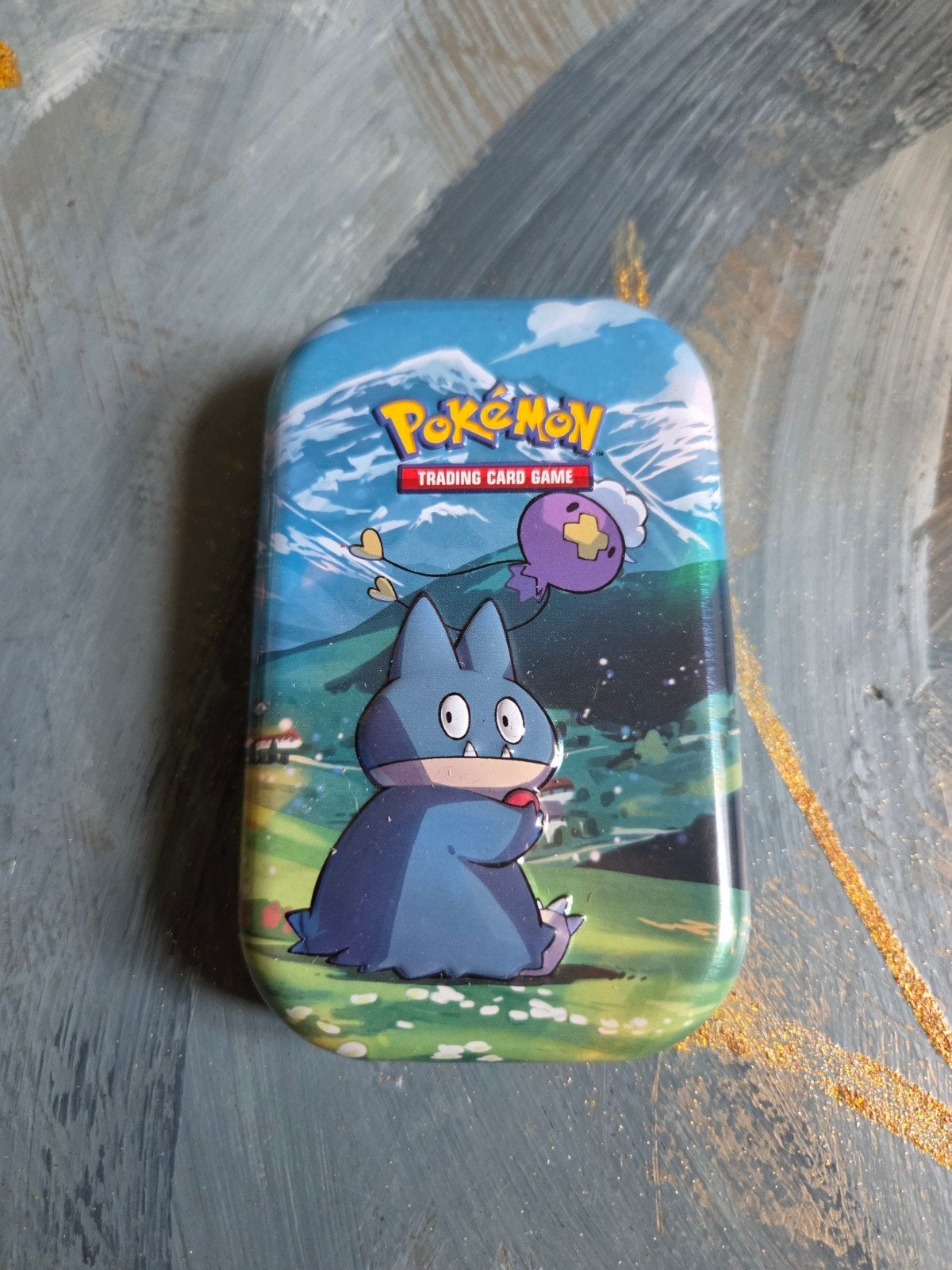 Pokémon Trading Card Game blikje met Munchlax, Hobby en Vrije tijd, Verzamelkaartspellen | Pokémon, Ophalen of Verzenden, Gebruikt