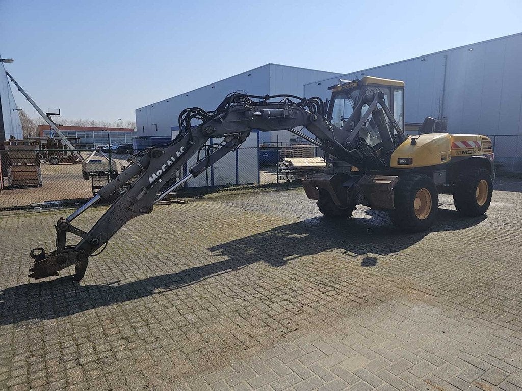Mecalac - 12MSX - Incl. bakken + palletvorken - Mobiele kraa, Zakelijke goederen, Machines en Bouw | Kranen en Graafmachines, Graaflaadcombinatie