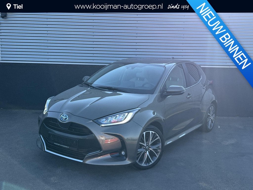 Toyota Yaris 1.5 Hybrid Executive Stoelverwarming, HUD, Smar, Auto's, Toyota, Gebruikt, Euro 6, Bruin, 1490 cc