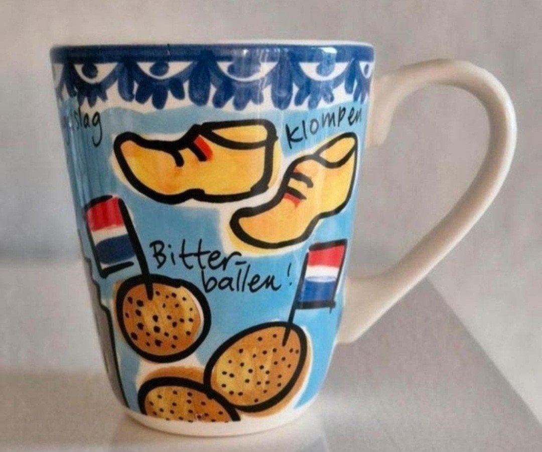 Beker Blond Amsterdam Learning Dutch while you're drinking, Ophalen of Verzenden, Zo goed als nieuw, Aardewerk, Kop(pen) en/of Schotel(s)