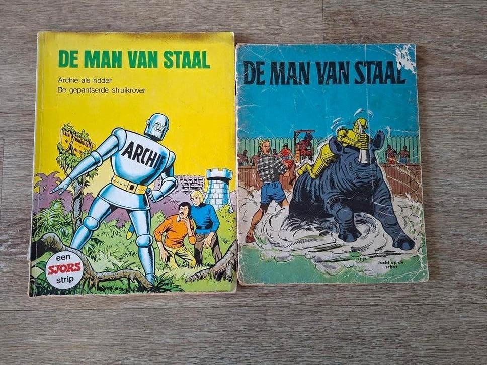 2 stripboeken De Man van Staal - Gelezen staat, Meerdere stripboeken, Ophalen of Verzenden, Gelezen