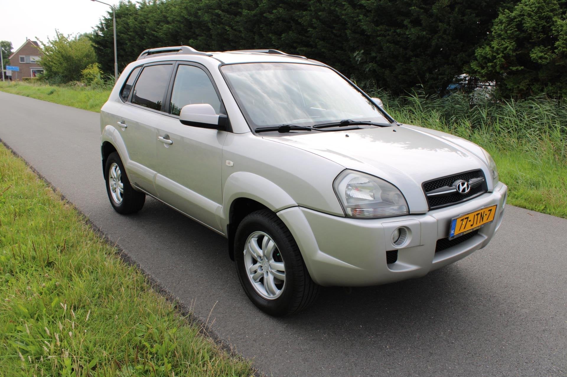 Hyundai Tucson 2.0i Style Supreme met Leder en Climate contr, Auto's, Dealer onderhouden, 4 cilinders, Handgeschakeld, Tucson