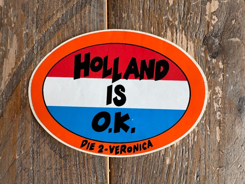 Sticker “Holland is O.K.” – Die 2 Veronica, Ophalen of Verzenden, Zo goed als nieuw, Film, Tv of Omroep