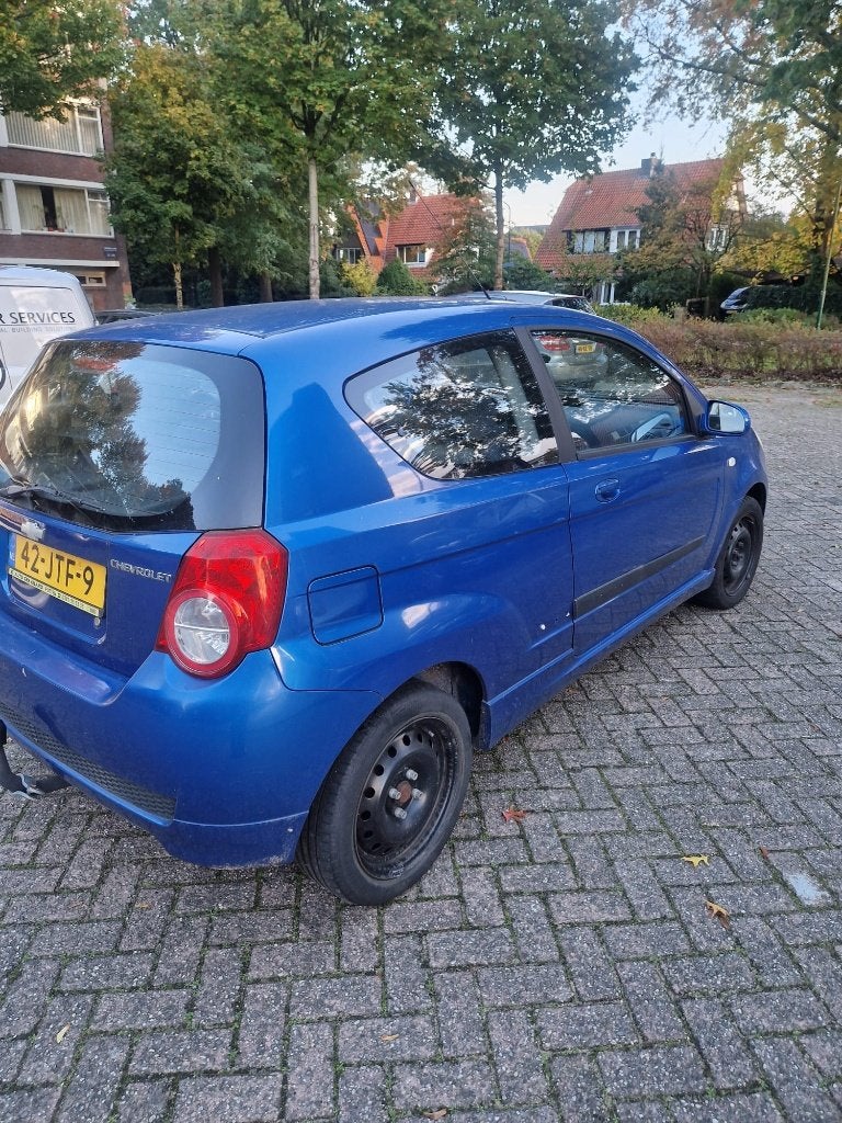 Chevrolet Aveo 1.4 16V 3D 2009 Blauw, Auto's, Voorwielaandrijving, Euro 5, Stof, 40 €/maand