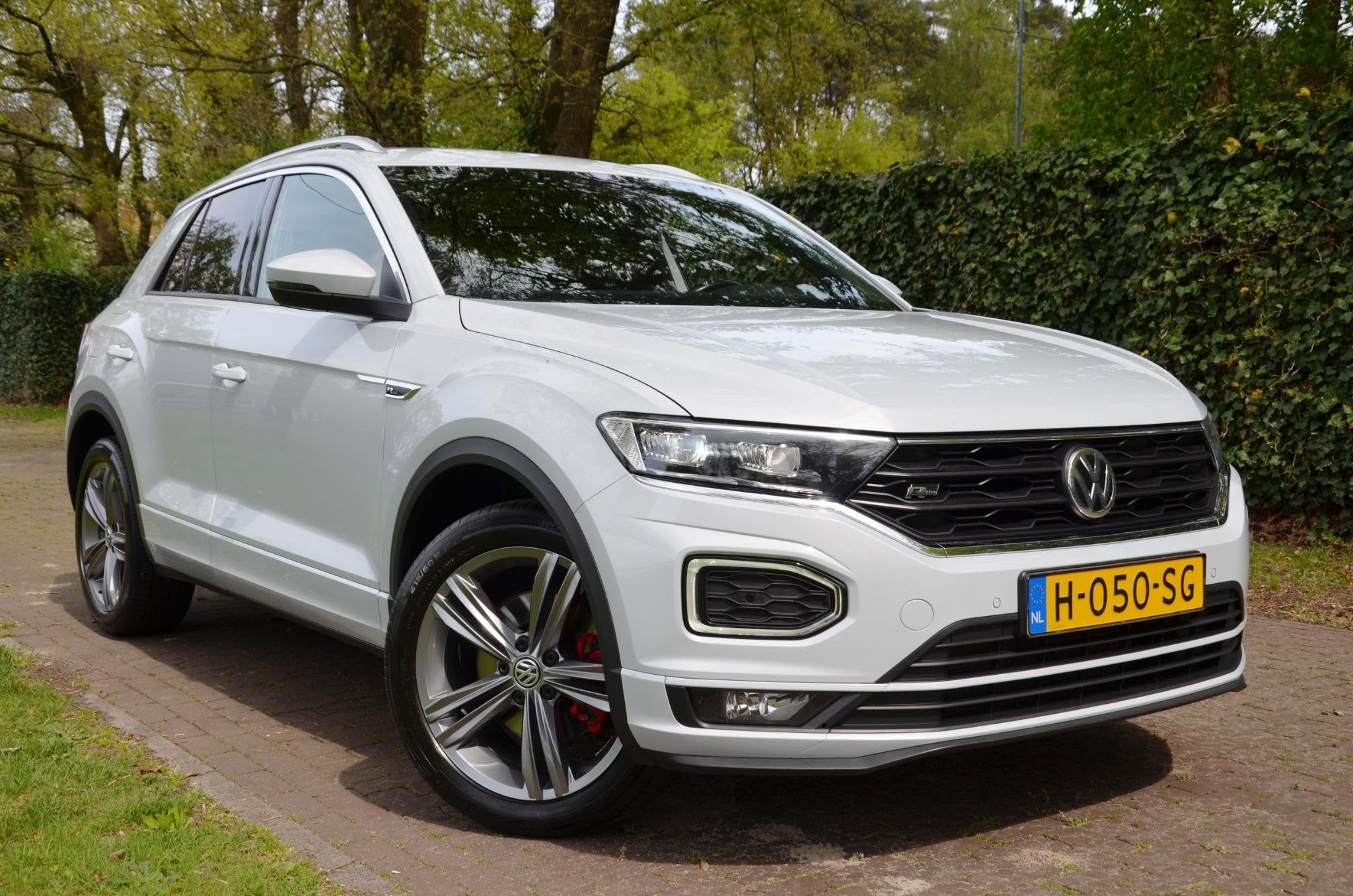 Volkswagen T-Roc 1.5 TSI Sport Business R Line Automaat/Navi, Auto's, Volkswagen, Stof, 4 cilinders, 150 pk, Automatische klimaatregeling