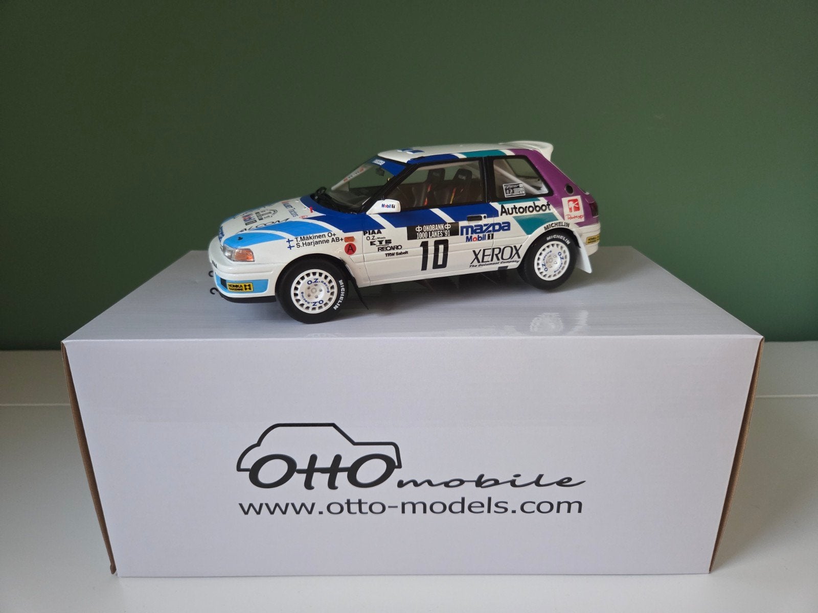 Otto Mobile 1:18 Mazda 323 GTX GR.A Rallye(OT1099) te koop!, Ophalen of Verzenden, Nieuw, Auto, OttOMobile