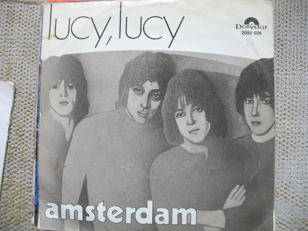 Amsterdam - Lucy Lucy, Gebruikt, 7 inch, Single, Ophalen of Verzenden