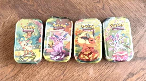Pokemon Prismatic Evolutions tins gesealed x 4, Ophalen of Verzenden, Nieuw, Meerdere kaarten, Foil