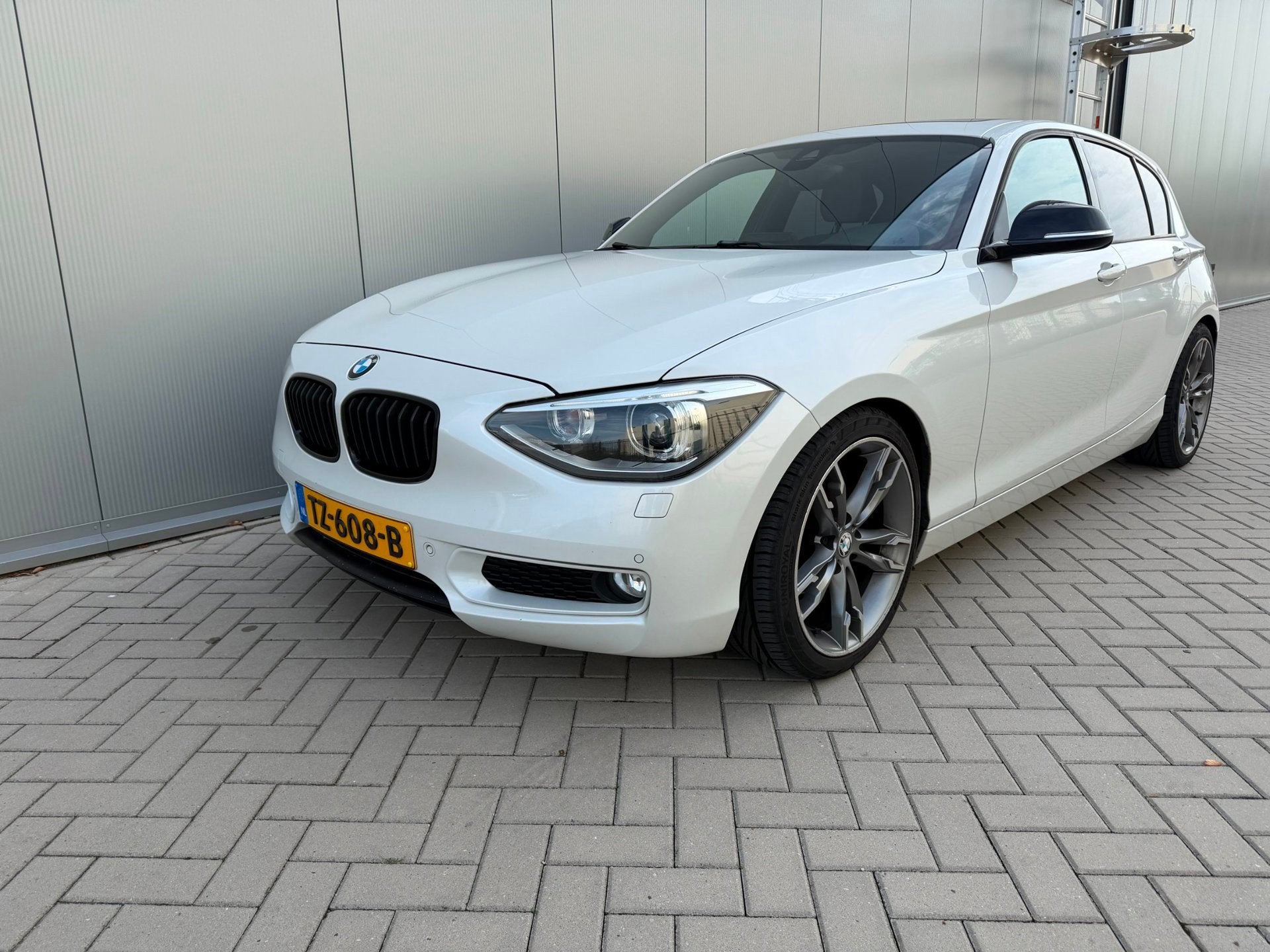 BMW 1-serie 116i Business, Auto's, Euro 5, Gebruikt, 4 cilinders, Leder en Stof