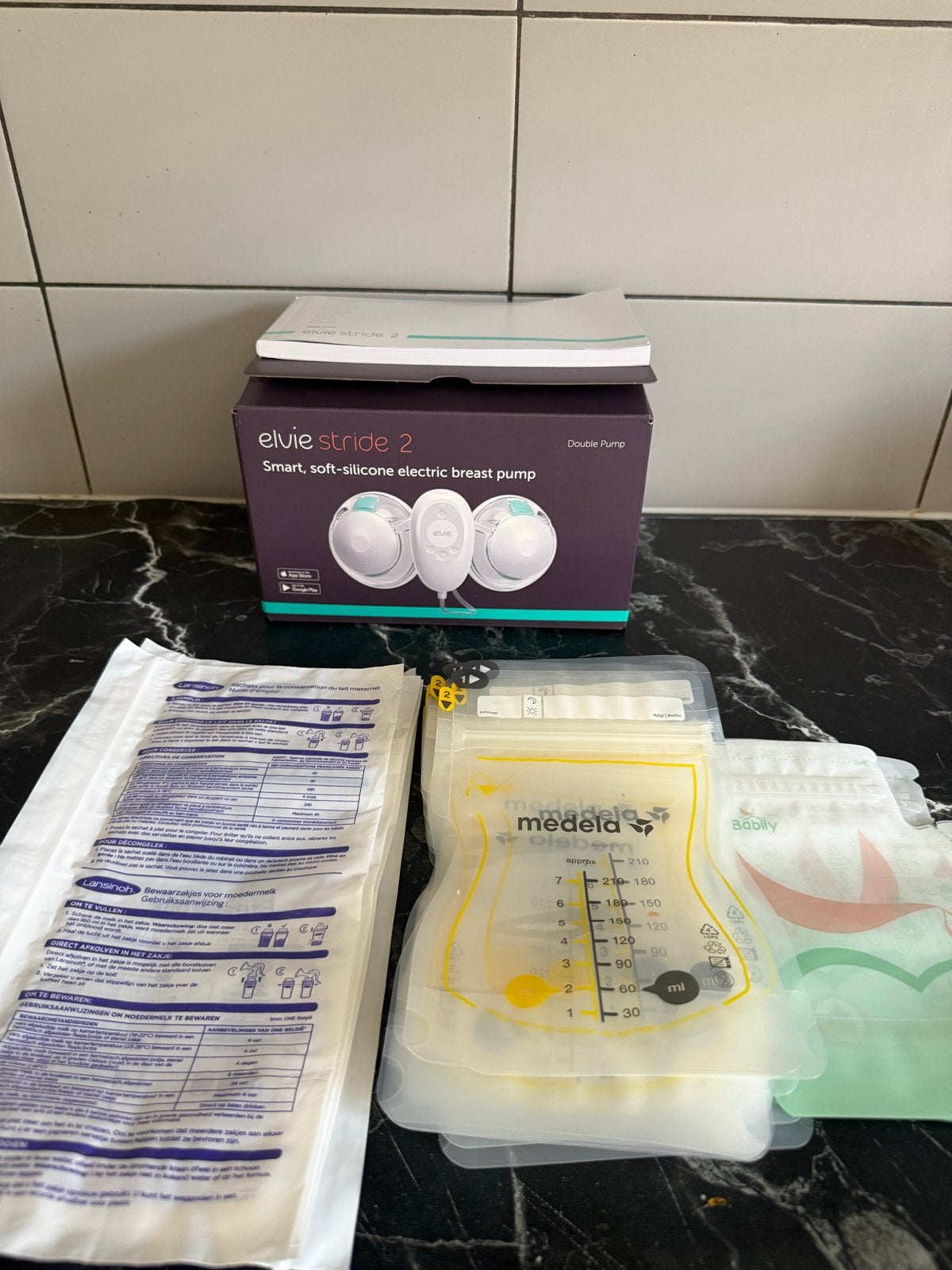 Elvie Stride 2 borstkolf + 3 soorten moedermelk bewaarzakjes, Ophalen of Verzenden, Zo goed als nieuw