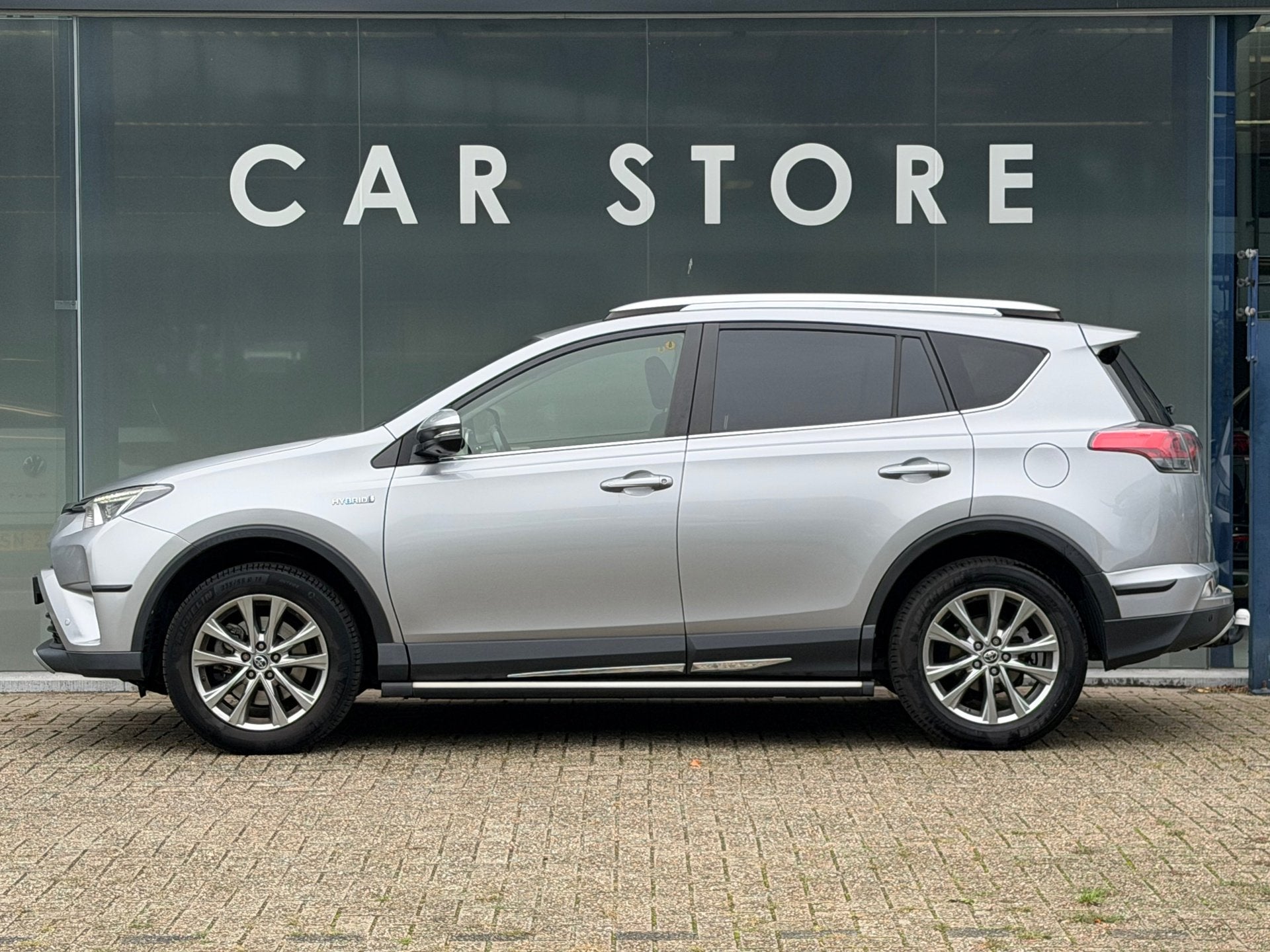 Toyota RAV4 2.5 Hybrid AWD Executive Trekhaak | Camera |, Auto's, Automaat, Gebruikt, 1650 kg, Leder
