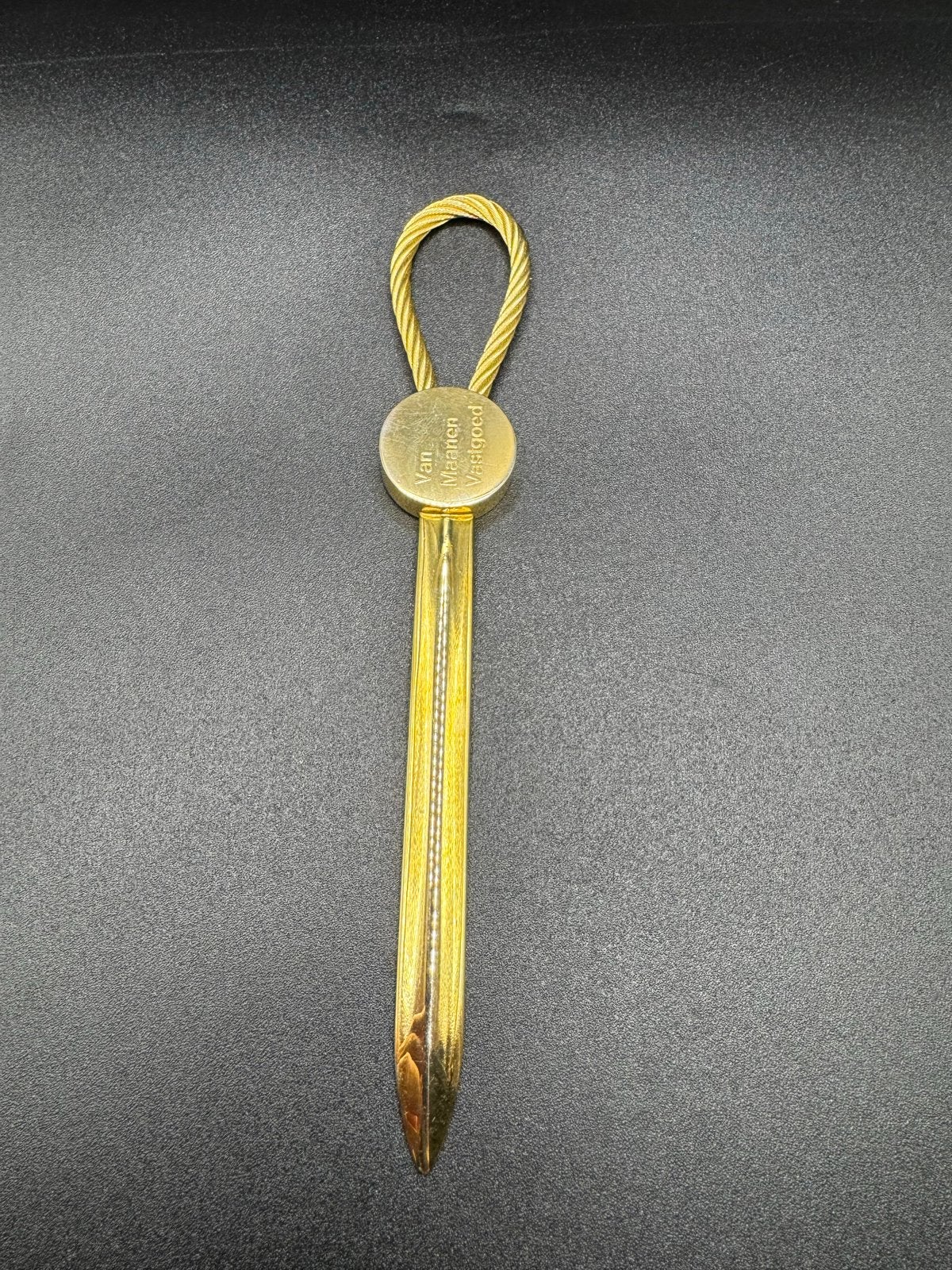 briefopener met 'Van Maanen Vastgoed' gravure, Verzenden