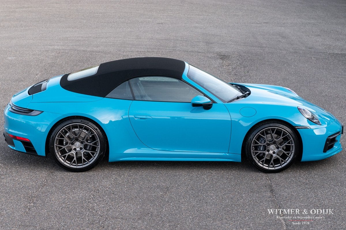 Porsche 911 Cabrio 3.0 Carrera Miami Blue (bj 2020), Automaat, Dealer onderhouden, Achterwielaandrijving, Gebruikt