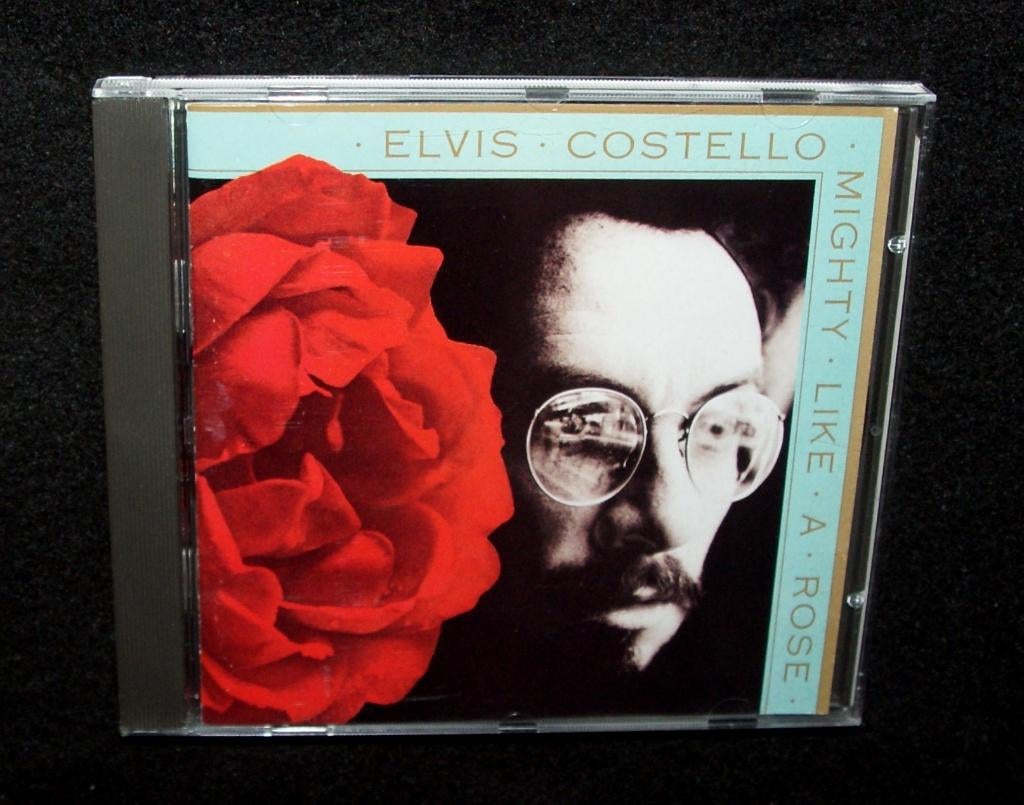 Elvis Costello - Mighty Like A Rose (Warner Bros. R., 1991), Ophalen of Verzenden, 1990 - 1999, Zo goed als nieuw