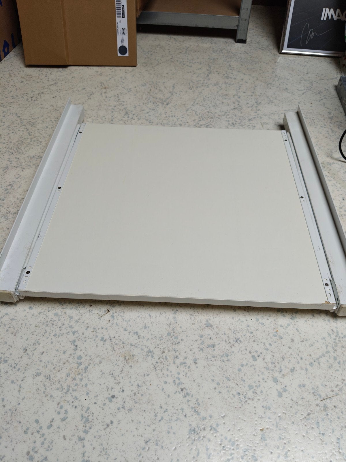 Tussenschot voor wasmachine/droger, Ophalen