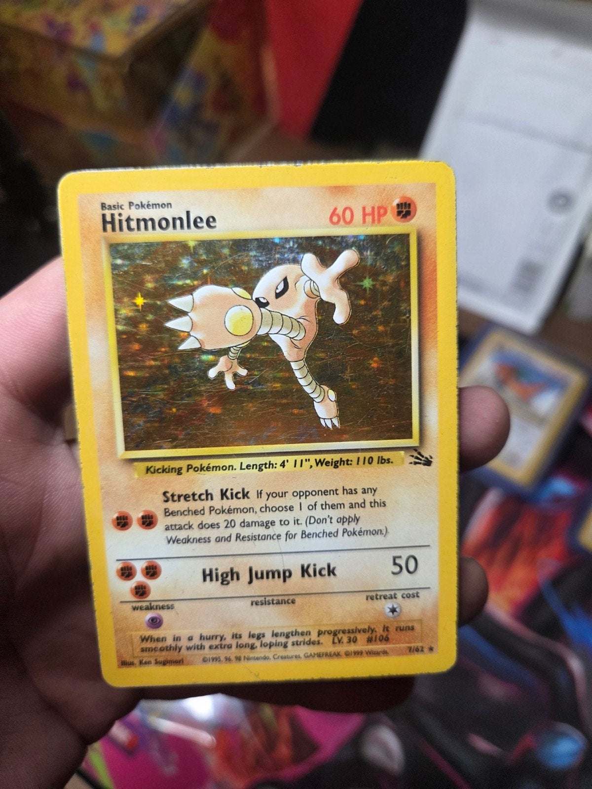 Hitmonlee Holo 7/62 Fossil 1999 Wizard of the coast era, Ophalen of Verzenden, Gebruikt, Losse kaart, Foil