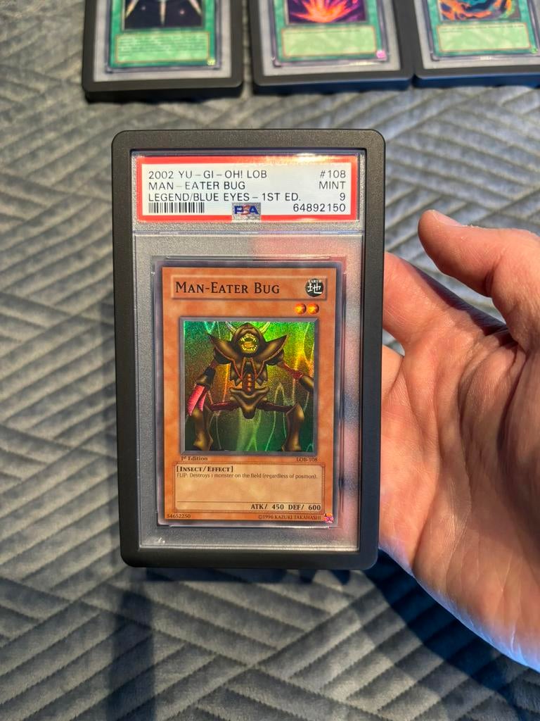 Yugioh PSA 9 LOB 108 1st edition Man Eater Bug, Ophalen of Verzenden, Zo goed als nieuw