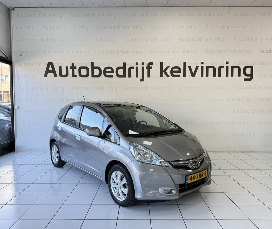 Honda Jazz 1.4 Hybrid Elegance Bovag Garantie 1e Eigenaar, Euro 5, Stof, Gebruikt, 4 cilinders