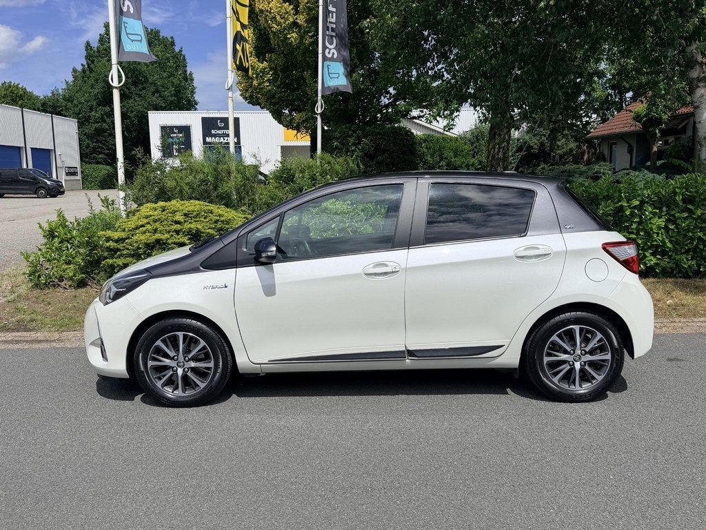 Toyota Yaris 1.5 Hybrid 100PK Y20 Automaat•Camera, Auto's, Toyota, Gebruikt, Euro 6, 4 cilinders, Wit