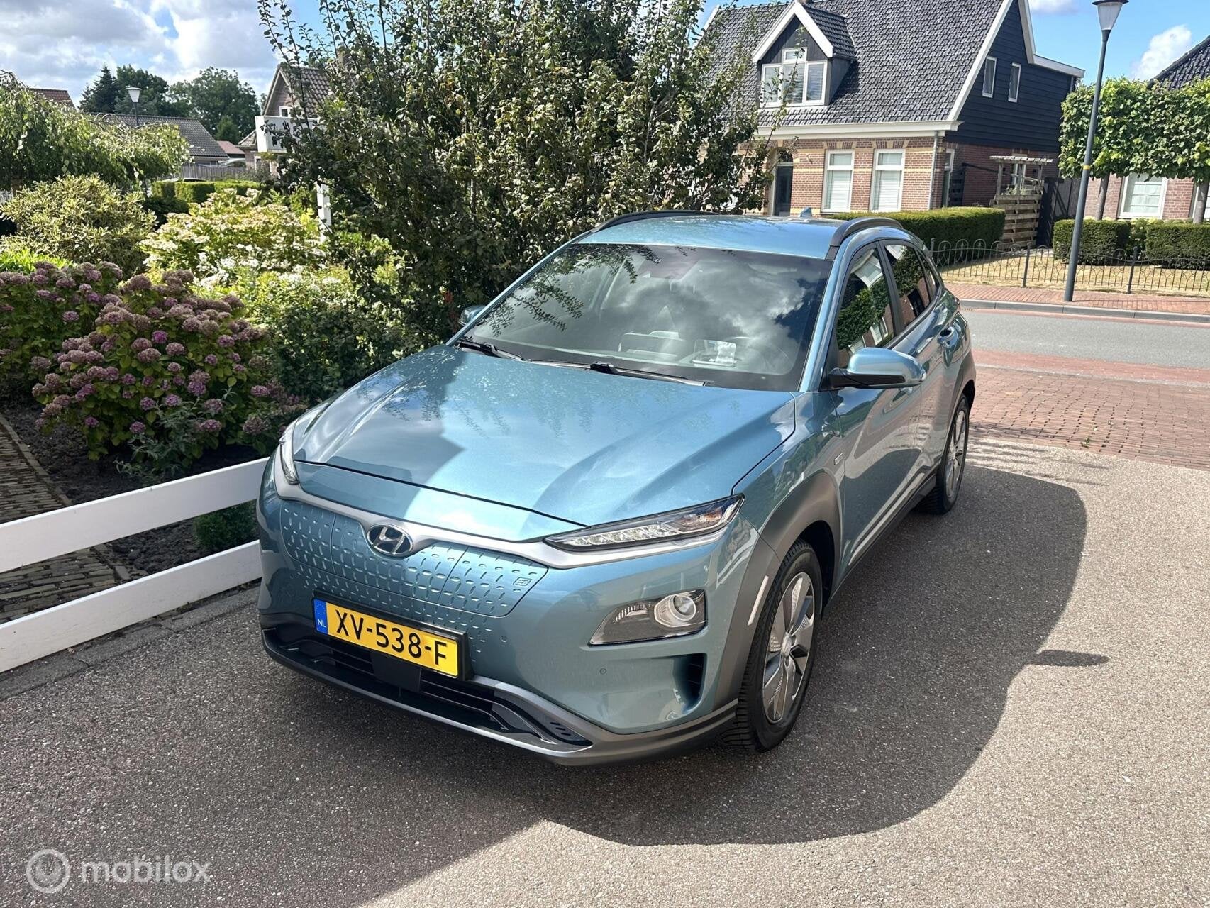 Hyundai Kona EV Premium 64 kWh SOH 100% WARMTE POMP ACHTERUI, Auto's, Gebruikt, Met garantie (alle), Blauw, Adaptive Cruise Control