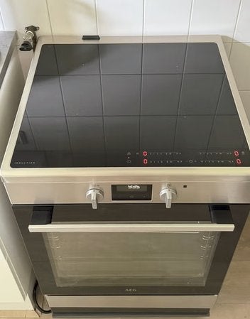AEG Inductie Fornuis 3 en 2 Fase Mogelijkheid Z.G.A.N, Ophalen, Hete lucht, 4 kookzones, Zo goed als nieuw