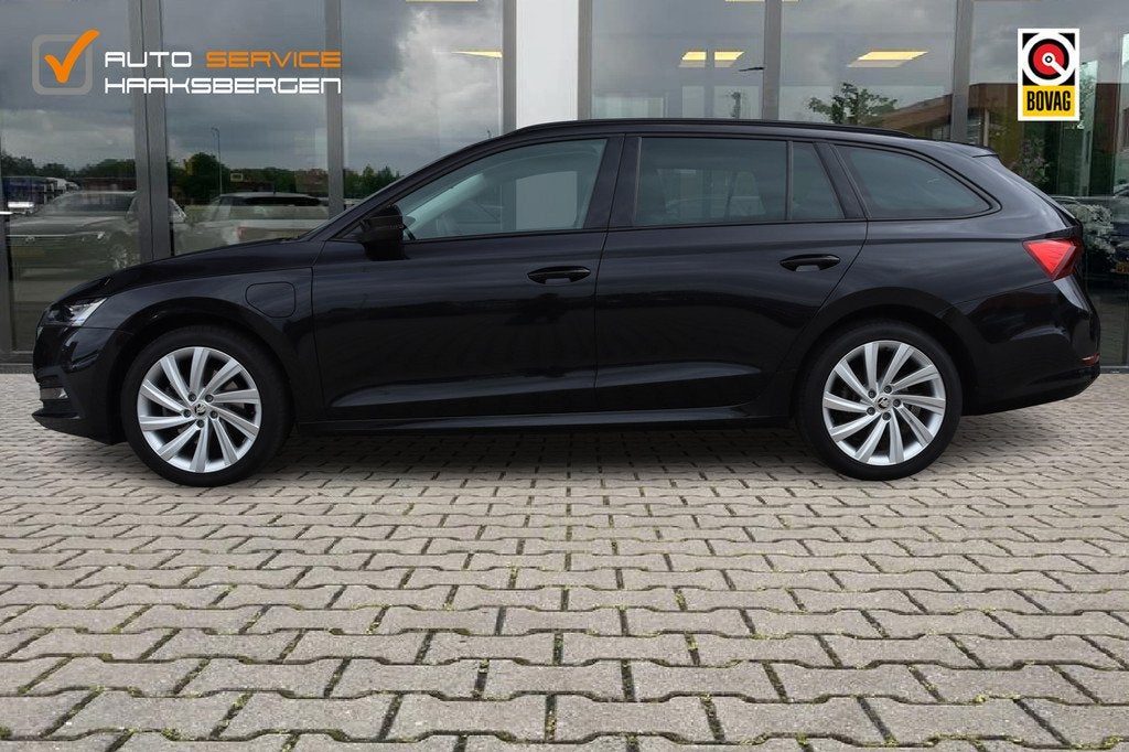 Skoda Octavia Combi 1.4 TSI iV PHEV Business Edition | ACC |, Auto's, Skoda, Gebruikt, Leder en Stof, Zwart, Plug-in hybride