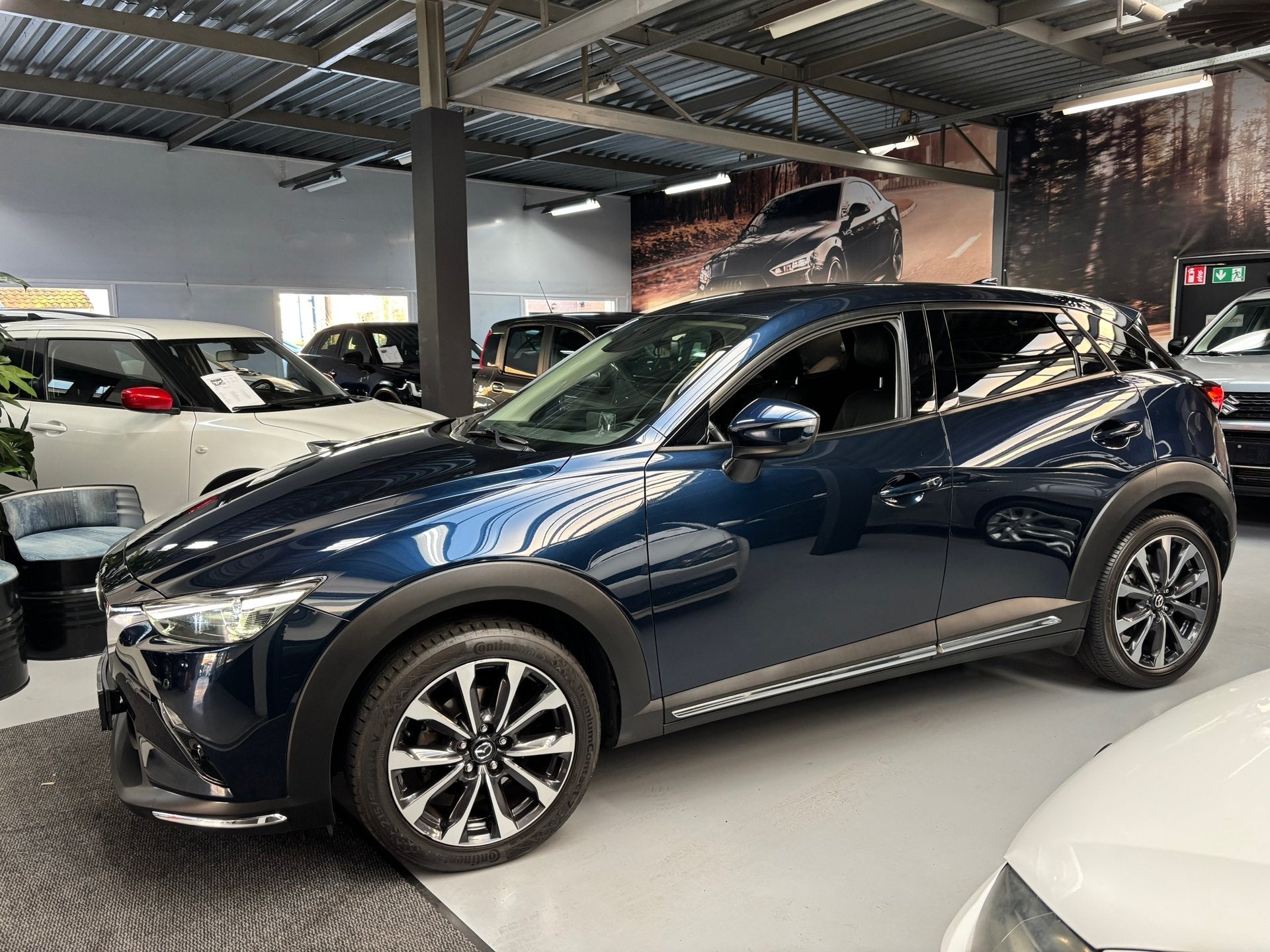 Mazda CX-3 2.0 SkyActiv-G 121 Luxury / Camera / Navigatie, 1998 cc, Gebruikt, 4 cilinders, Met garantie (alle)
