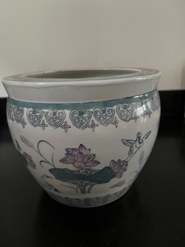 Oude bloempot., Ophalen