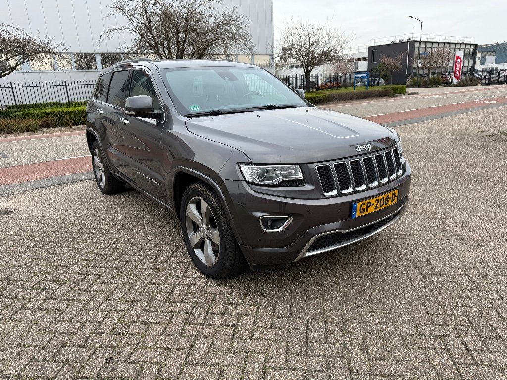 Jeep Grand Cherokee 3.0 CRD V6 184KW AUT 2014 Grijs, Auto's, Jeep, Euro 5, 2987 cc, Leder, Bedrijf