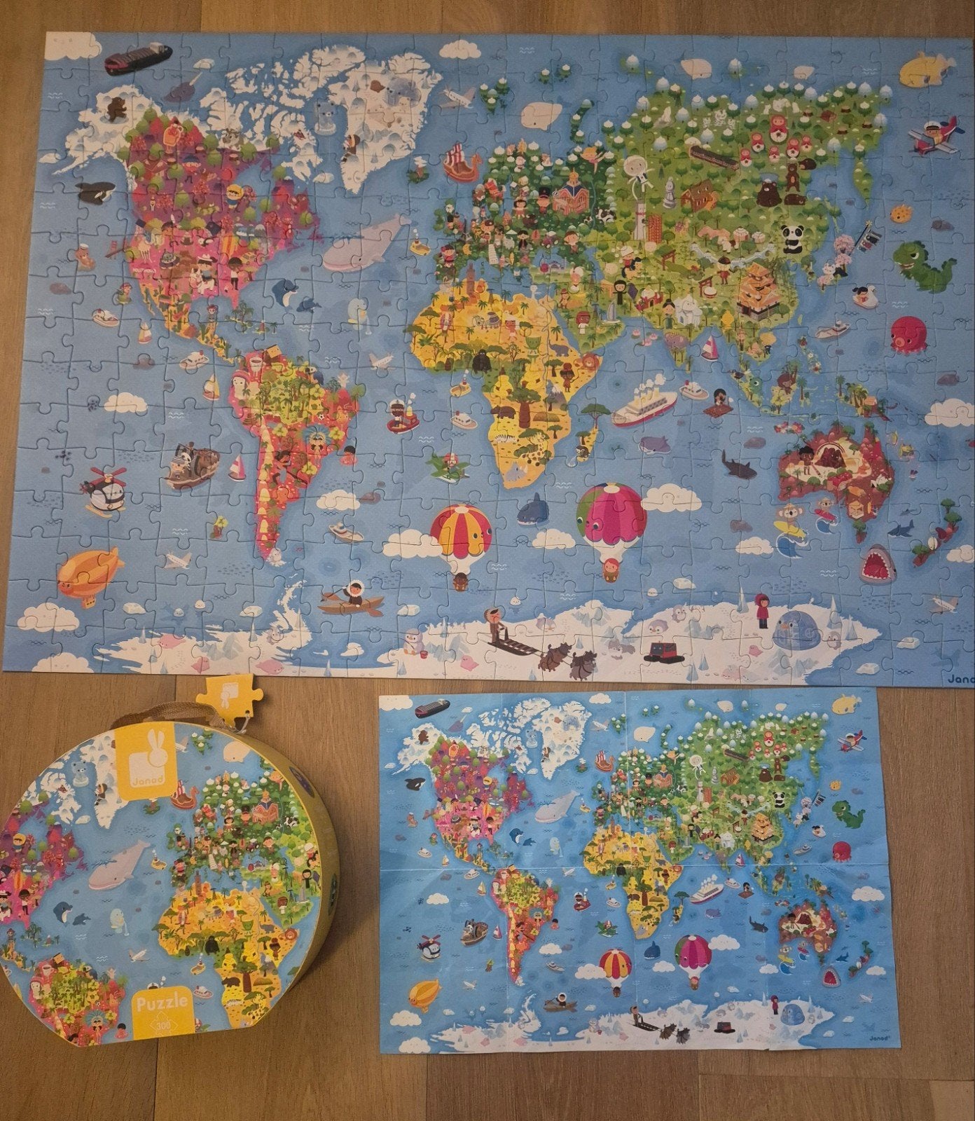 JANOD puzzel wereld groot - 300 stuks in een handige koffer, Hobby en Vrije tijd, Denksport en Puzzels, Ophalen of Verzenden, Minder dan 500 stukjes