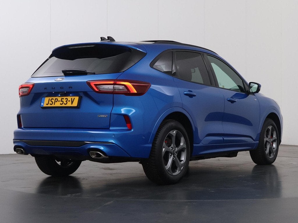 Ford Kuga 2.5 PHEV ST-Line X | Elek. Trekhaak | Panoramadak, Auto's, Ford, 14 kWh, Gebruikt, Blauw, Leder en Stof