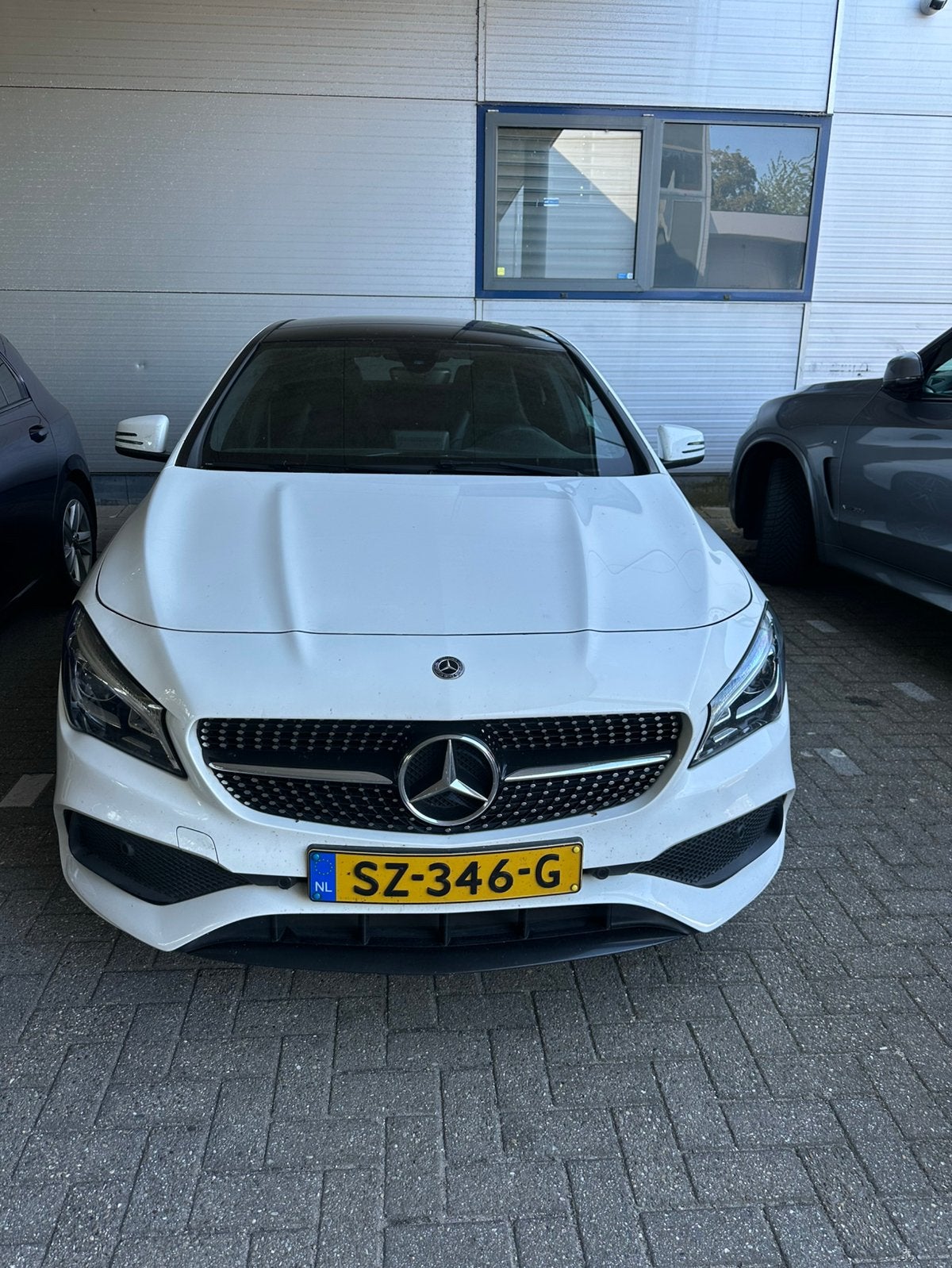 Mercedes-Benz CLA 180 122pk 7G-DCT 2018 Wit, 4 cilinders, 715 kg, 1200 kg, 19 km/l