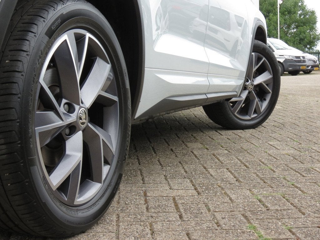 Skoda Kodiaq 1.5 TSI DSG Sportline Business Camera|Trekhaak|, Auto's, Skoda, 4 cilinders, 150 pk, Wit, Origineel Nederlands